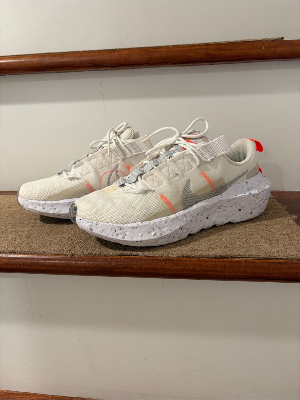 Nike Women’s Cream/White Sneakers with Gray Swoosh and Orange Accents